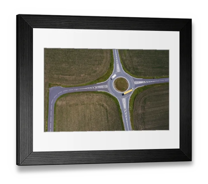 Framed Print : Drone image, roundabout with lorries between harvested fields