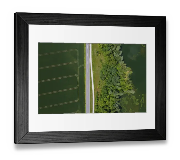 Framed Print : Drone image, country road between fields and pond