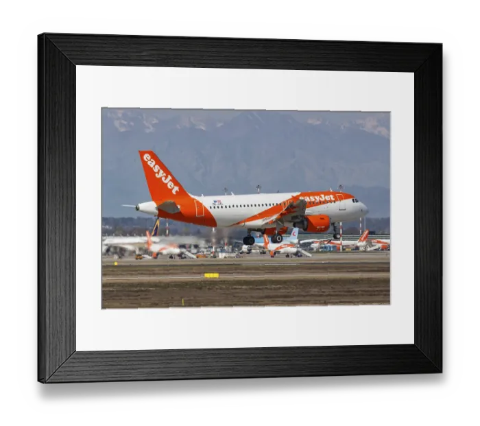 Framed Print : An EasyJet Europe Airbus A319 aircraft with registration number OE-LKL at Milan Malpensa Airport