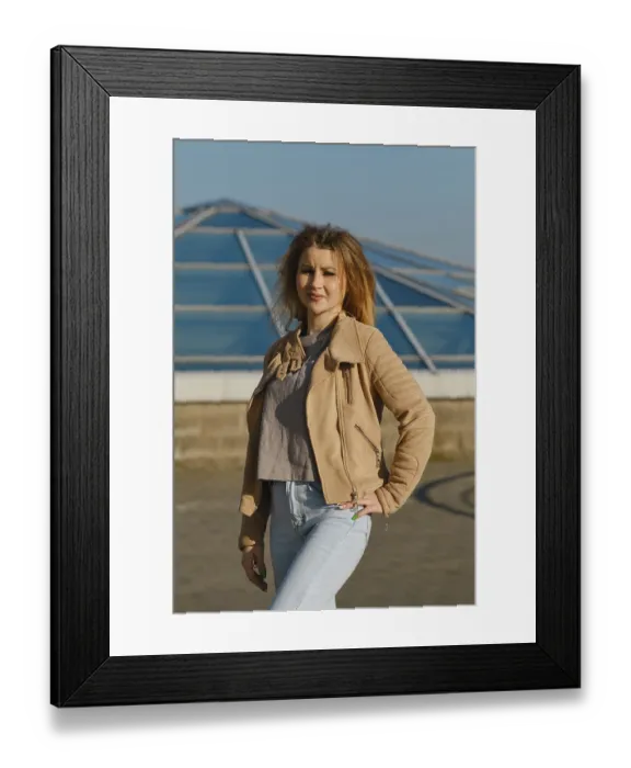 Framed Print : A young woman stands proudly outdoors