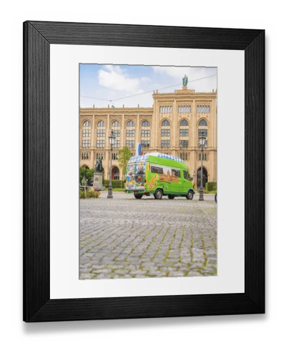 Framed Print : A colourfully painted bus in front of a historic building with a cobbled street and lanterns