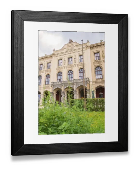 Framed Print : A magnificent historic building with ornate facades surrounded by lush green plants