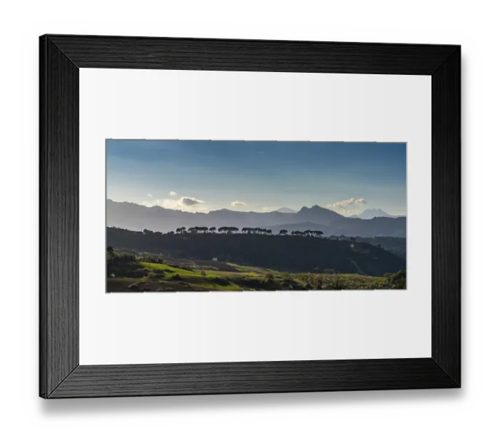 Framed Print : A landscape view of fields around Ronda with the Serrania de Ronda in the background