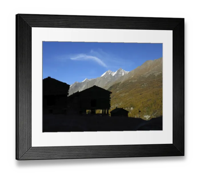 Framed Print : Silhouettes of traditional huts on pillars