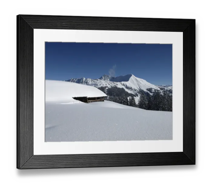 Framed Print : Mountain named Lauenenhorn and snow covered hut