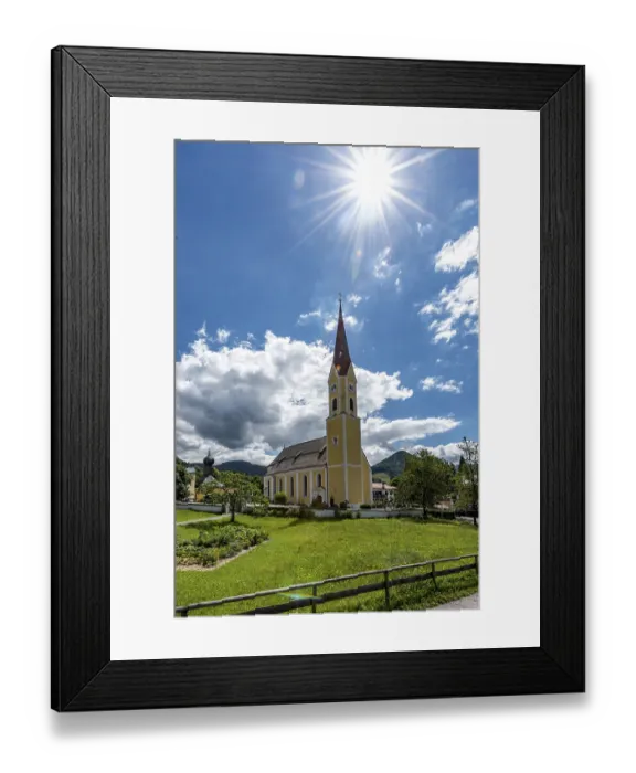 Framed Print : Church at Schliersee in Bavaria Germany with sun and blue sky in front of wooded mountains