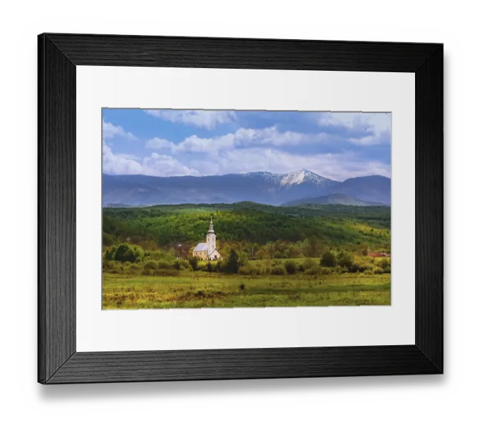 Framed Print : Church against the backdrop of the Carpathian Mountains in Romania