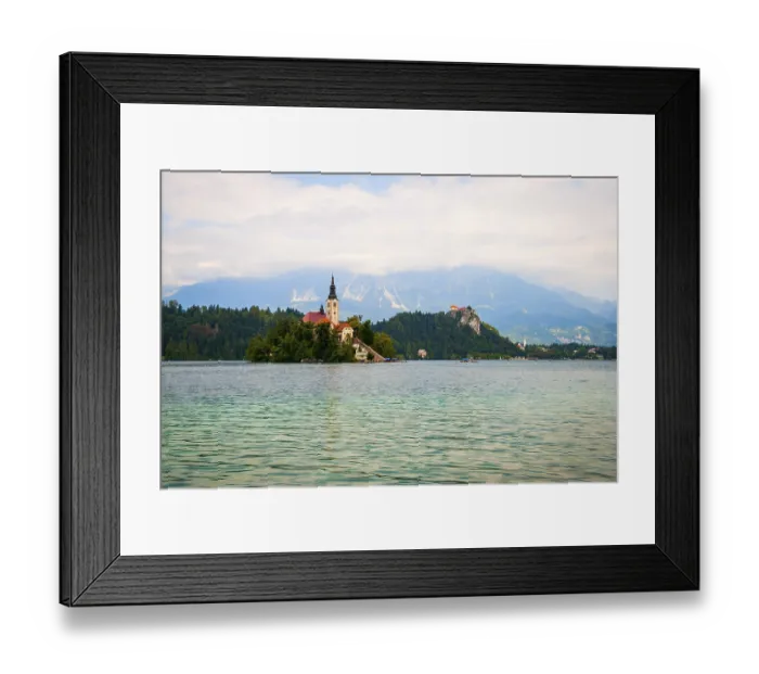 Framed Print : Beautiful view on lake Bled against of mountains in clouds