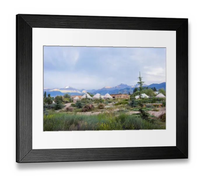 Framed Print : Yurts between the trees and bushes against the mountain landscape Framed Print : Yurts between the trees and bushes against the mountain landscape