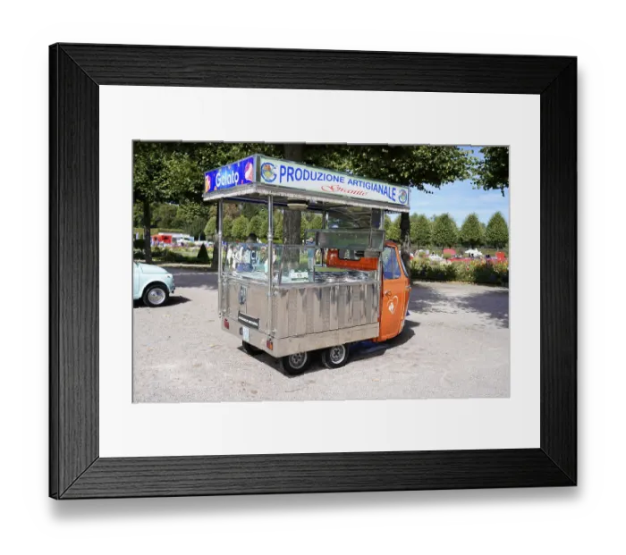 Framed Print : Small orange vending cart with open gelato area in a park