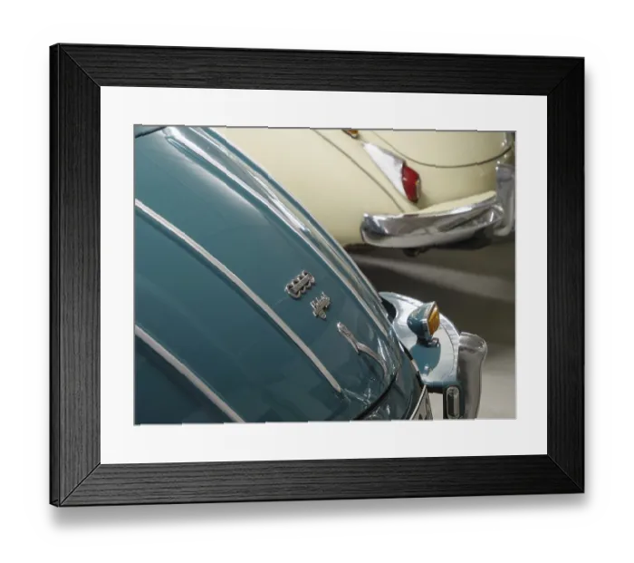 Framed Print : Close-up of two Audi classic cars in different colours with chrome details