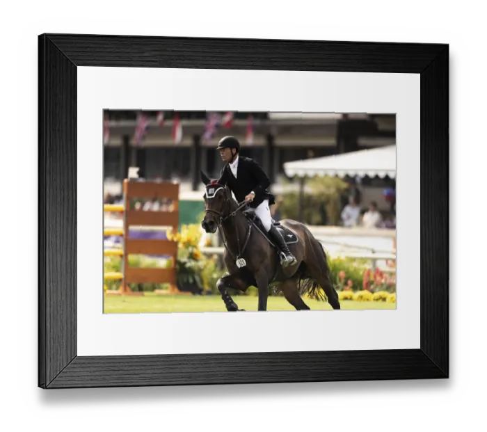 Framed Print : Kyle King of the USA, riding Kayenne Z competes in the CPKC Grand Prix during the Spruce Meadows Masters in Calgary