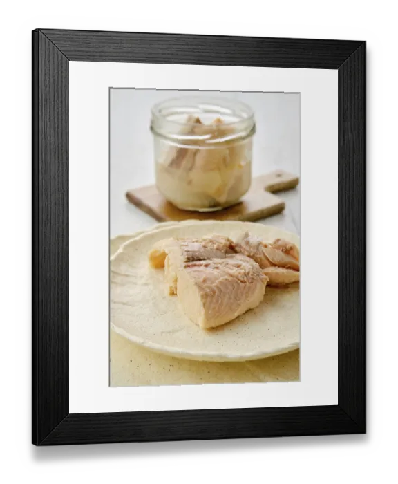 Framed Print : Closeup view of canned sea trout on a plate