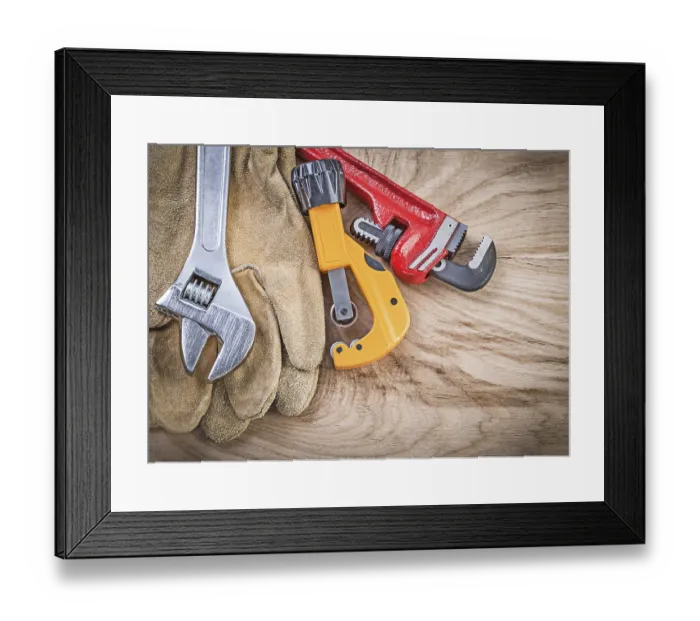 Framed Print : Set of protective gloves adjustable spanner monkey wrench pipe cutter on wooden board plumbing concept