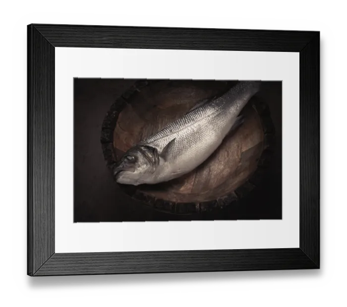 Framed Print : Fresh, raw sea bass fish, in a wooden plate Framed Print : Fresh, raw sea bass fish, in a wooden plate
