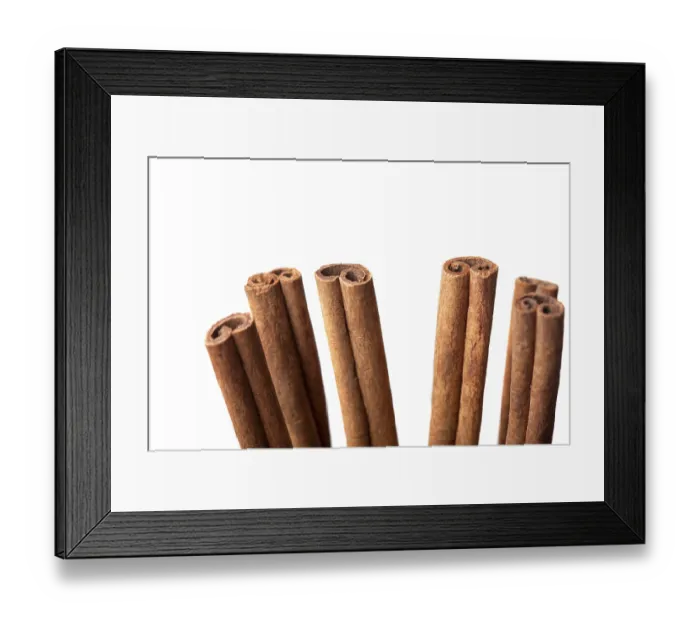 Framed Print : Close-up of dried cinnamon sticks on white paper Framed Print : Close-up of dried cinnamon sticks on white paper