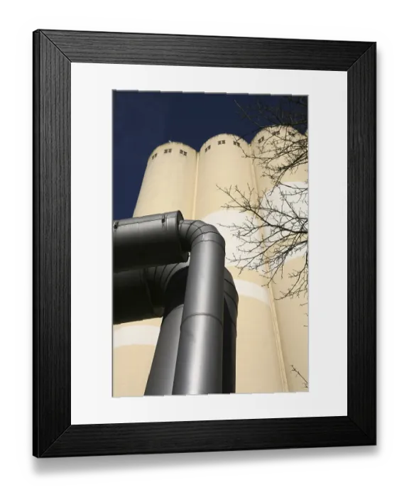 Framed Print : With grain silos of a mill