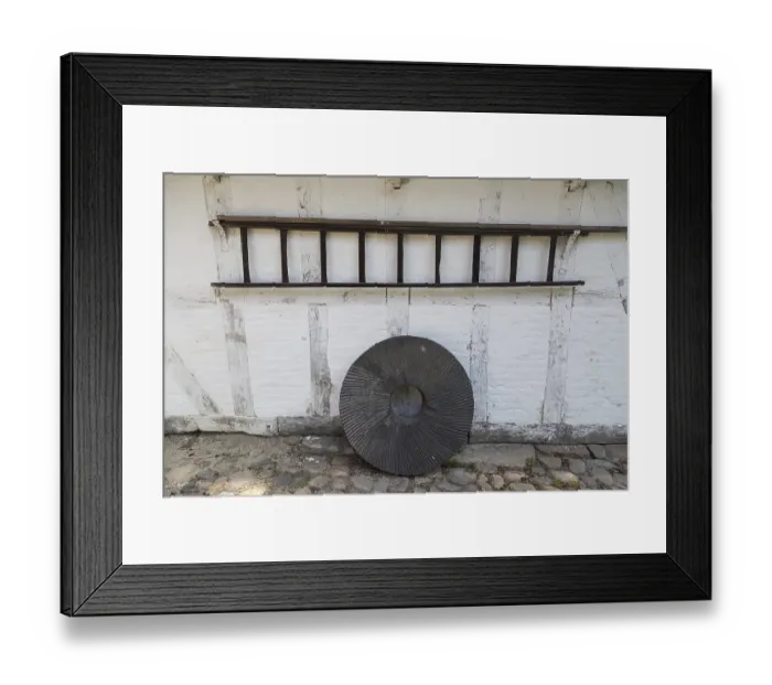 Framed Print : A standing millstone and hanging wooden ladder Framed Print : A standing millstone and hanging wooden ladder