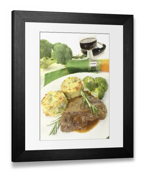 Framed Print : Venison medallions with potato gratin and rosemary against a light background Framed Print : Venison medallions with potato gratin and rosemary against a light background