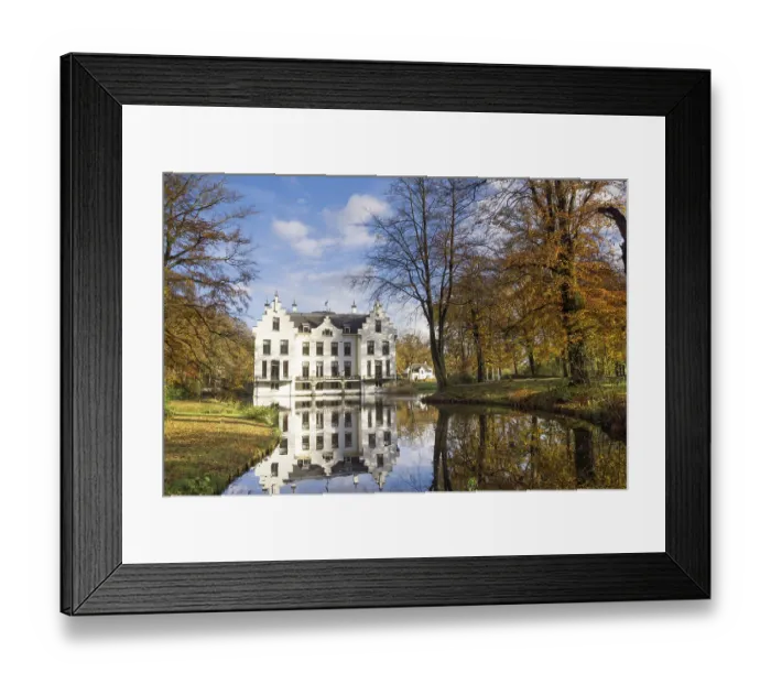 Framed Print : Castle Staverden reflecting in the moat and surrounded by autumn colored trees