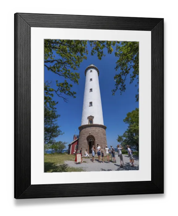 Framed Print : Tourists stand in front of the Lange Erik lighthouse