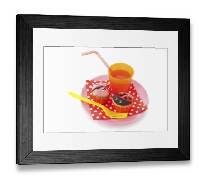 Framed Print : Colorful cupcakes with lemonade as treat for the child party Framed Print : Colorful cupcakes with lemonade as treat for the child party