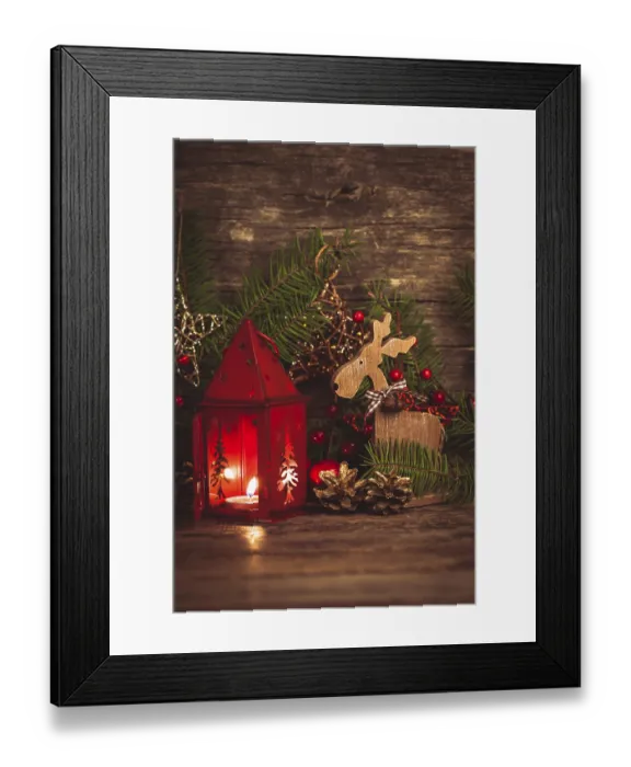 Framed Print : Red christmas candlestick over holiday decorations on the table