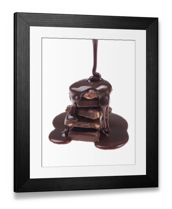 Framed Print : Chocolate flow isolated on white background close up Framed Print : Chocolate flow isolated on white background close up