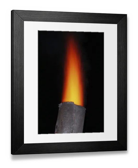 Framed Print : Red torch flame over the old metal chimney at night