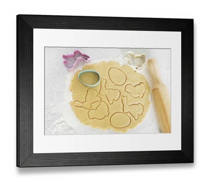 Framed Print : Dough with cookie cutters and rolling pin on kitchen table Framed Print : Dough with cookie cutters and rolling pin on kitchen table