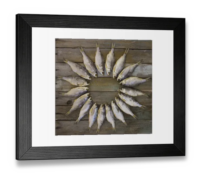 Framed Print : The dried fish on a wooden table