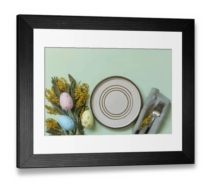 Framed Print : Table setting for Easter dinner with easter eggs and mimosa on a pastel background Framed Print : Table setting for Easter dinner with easter eggs and mimosa on a pastel background