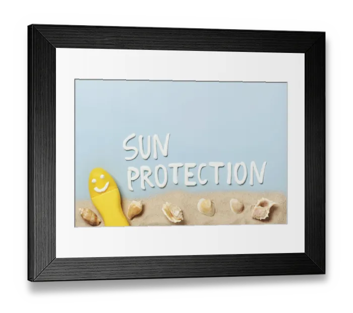 Framed Print : Yellow tube with happy sunscreen face with SUN PROTECTION word on blue background