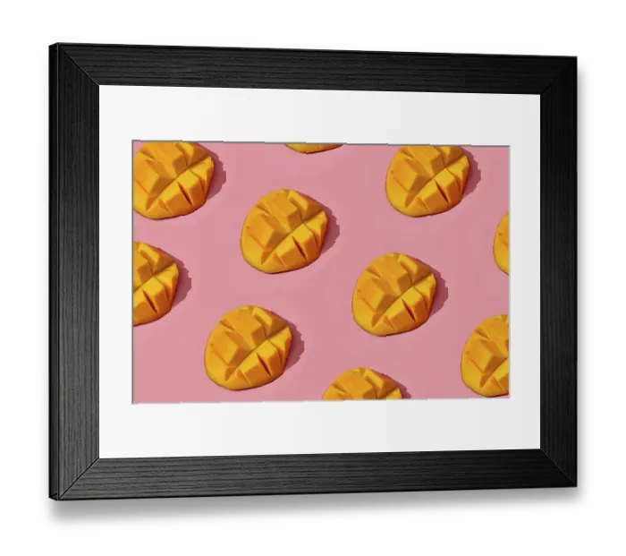 Framed Print : Food design. Top view of colorful fruit pattern of fresh juicy cutted into cubes mango on coral pink pastel background