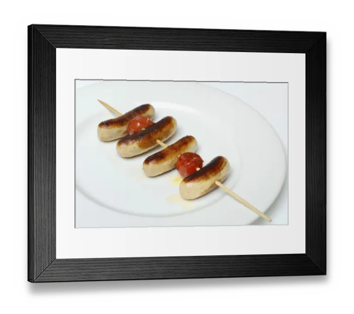 Framed Print : Chipolata sausages on wooden skewers