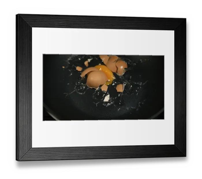 Framed Print : Egg bursting into a stove