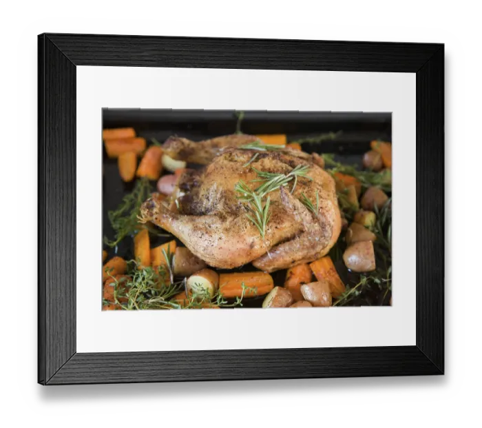Framed Print : A roast chicken on a baking tray with rosemary