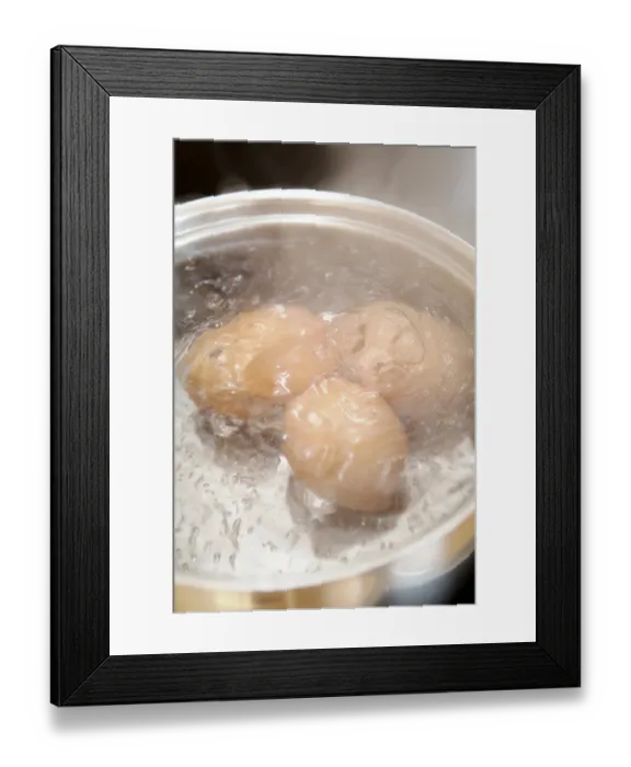 Framed Print : Eggs are cooked in pot