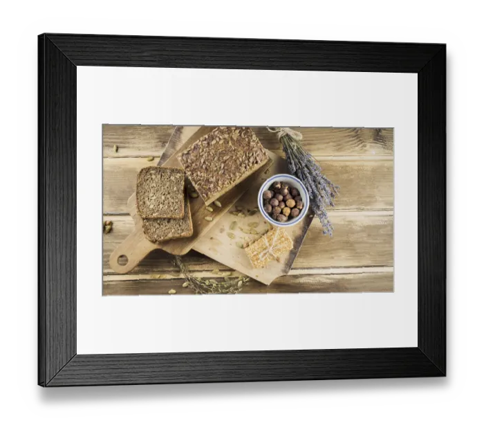 Framed Print : Top view whole grain bread hazelnut bowl with protein bar chopping board