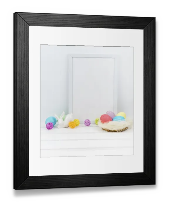 Framed Print : Easter eggs nest with blank frame table