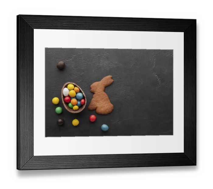 Framed Print : Chocolate easter egg filled with colorful candy bunny shaped cookie