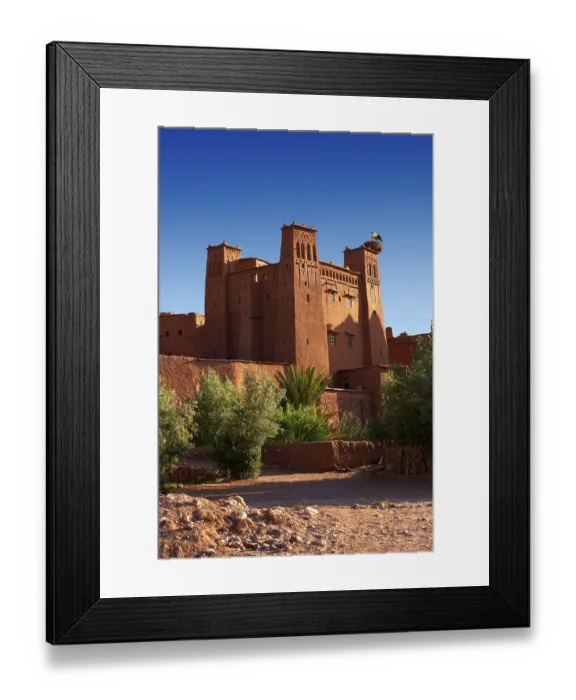 Framed Print : Mud buildings of the fortified Berber Ksar of Ait Benhaddou with a stork's nest Framed Print : Mud buildings of the fortified Berber Ksar of Ait Benhaddou with a stork's nest
