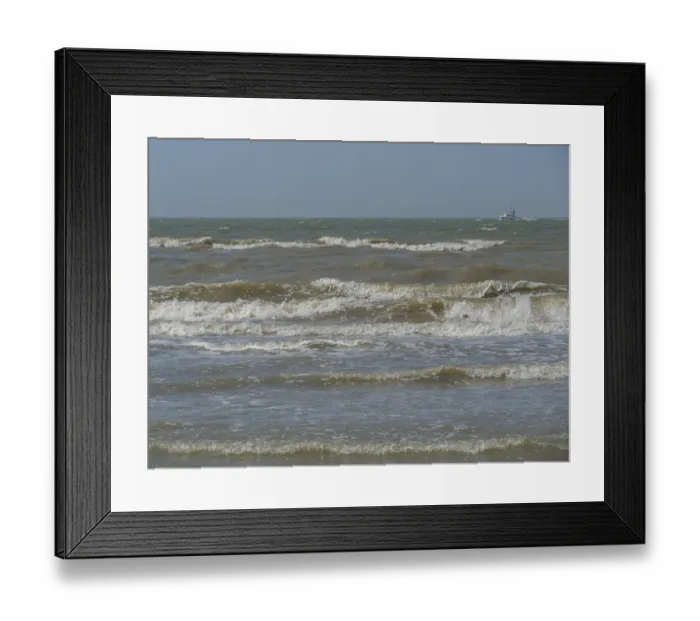 Framed Print : Stormy sea with strong waves and a boat on the horizon