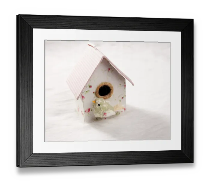Framed Print : Bird in a nest fabric house with round window in pastel colors