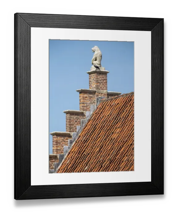 Framed Print : Stone lion on medieval gable and house roof in the netherlands