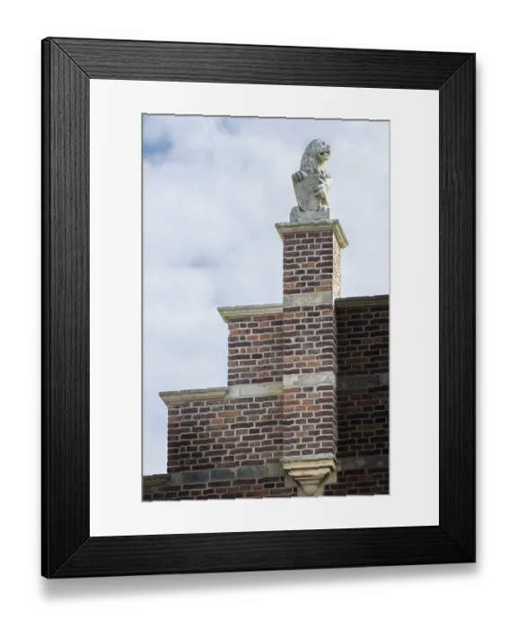 Framed Print : Stone lion on medieval gable and house roof in the netherlands Framed Print : Stone lion on medieval gable and house roof in the netherlands