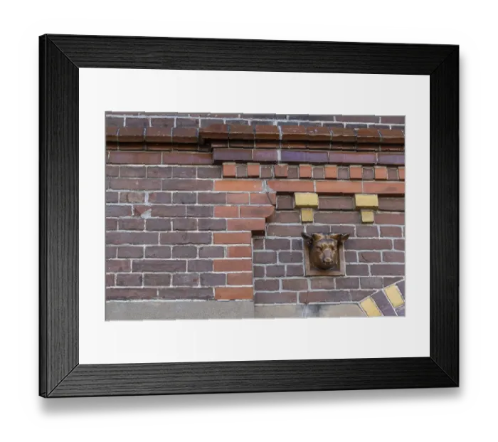 Framed Print : Brick facade with dentils and ox head