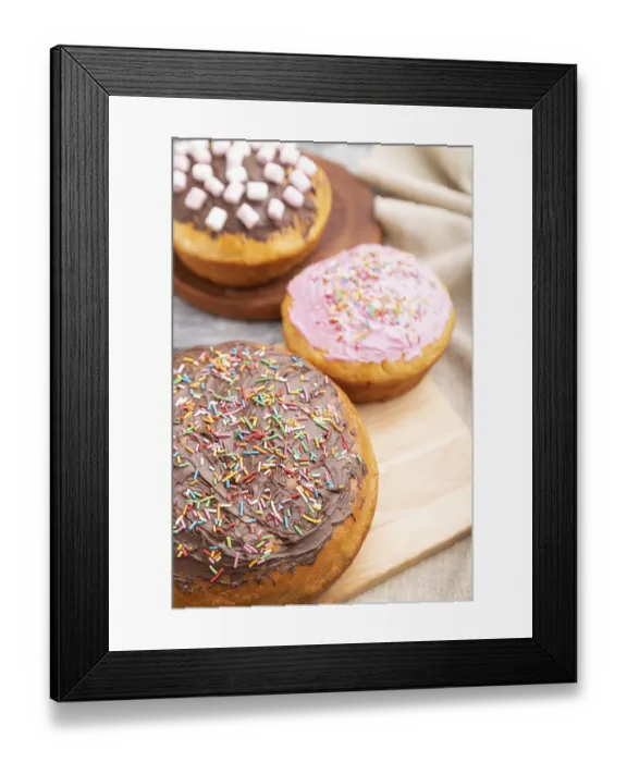 Framed Print : Homemade glazed and decorated easter pies with chocolate eggs and rabbits on a gray wooden background and linen textile