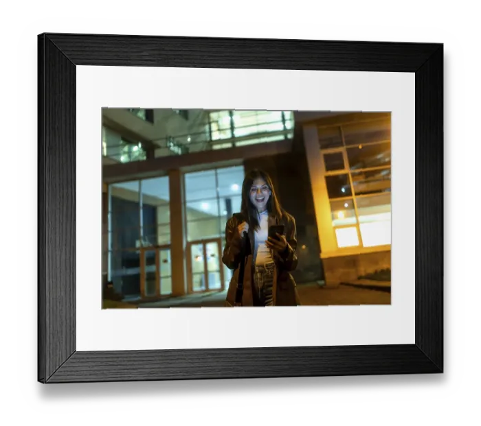 Framed Print : Young woman standing on an urban street at night Framed Print : Young woman standing on an urban street at night