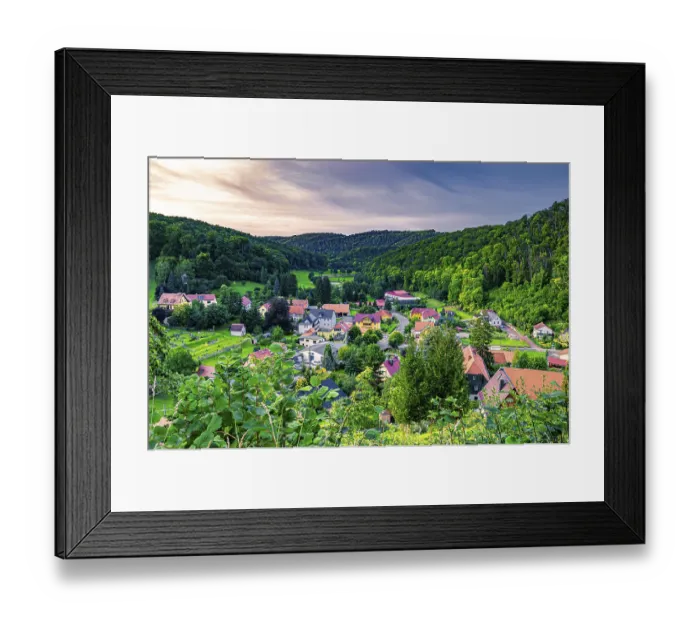 Framed Print : The village of Tautenburg surrounded by mixed forest in summer at sunset
